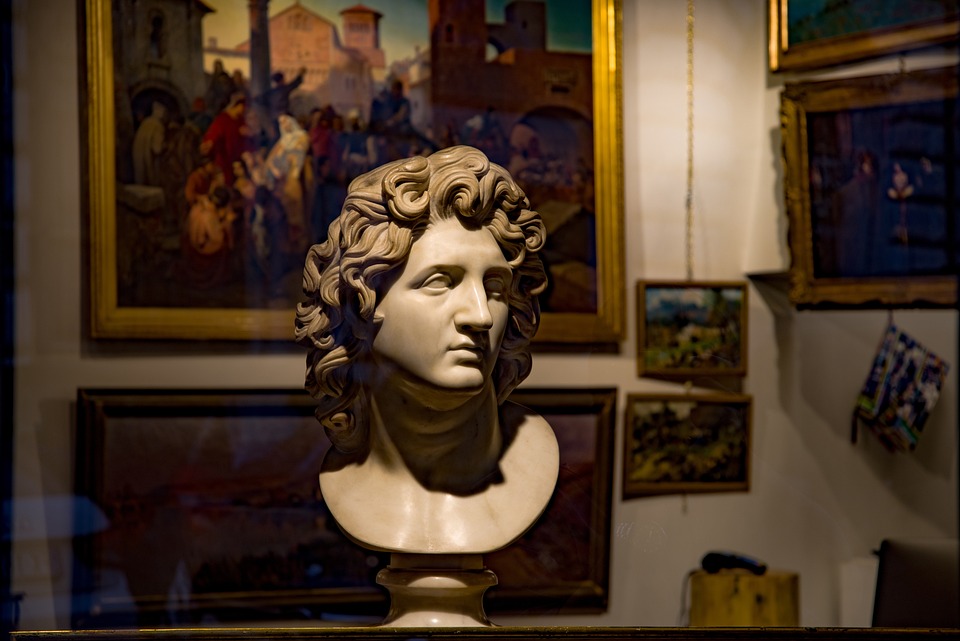 Photograph of a bust and paintings to illustrate art galleries in Munich