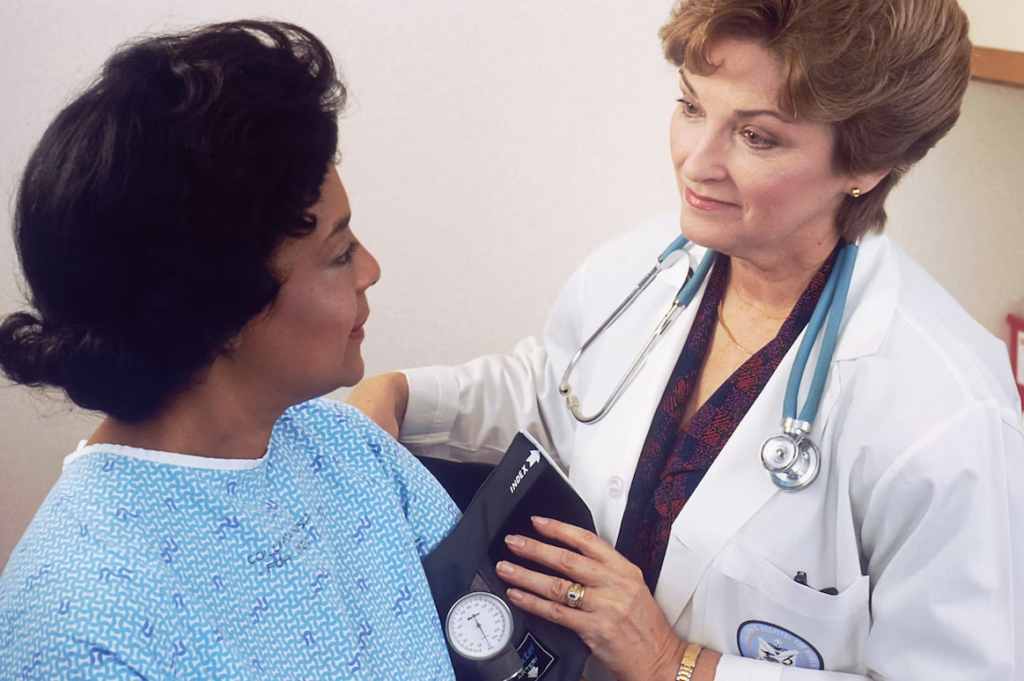 photograph showing a female doctor talking with a female patient