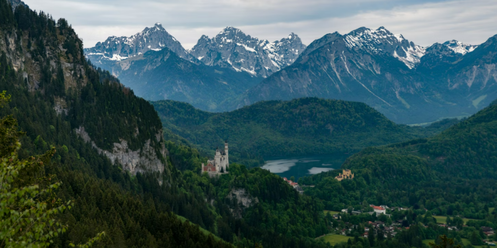 Photograph showing a scenic view of lakes and mountains in the Bavarian Alps