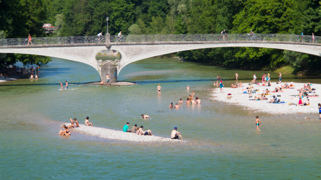 photo of people splashing about in the waters at Isarstrand in Munich, Germany